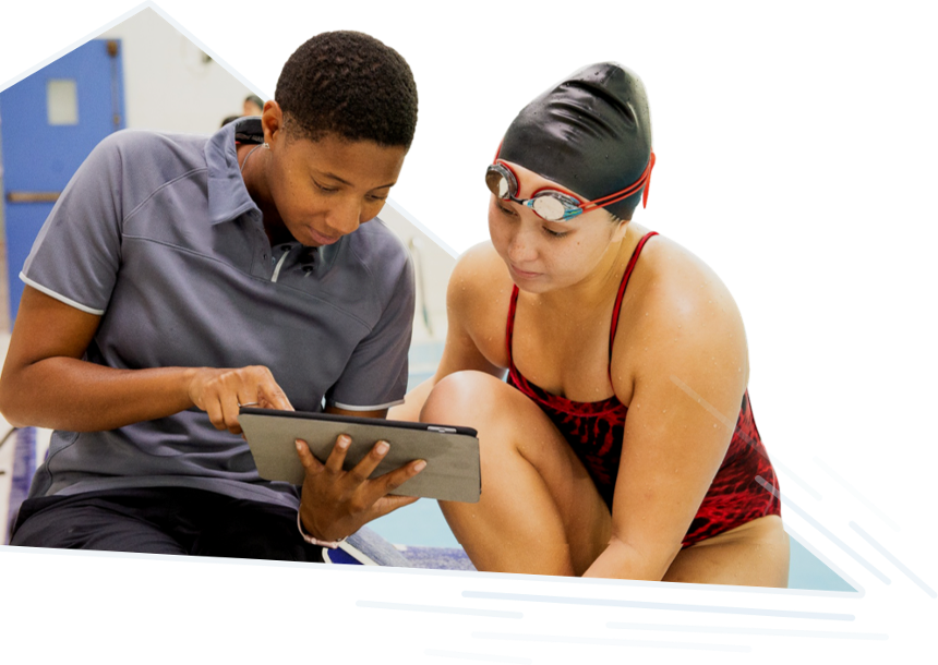 coach and swimmer using TritonWear poolside